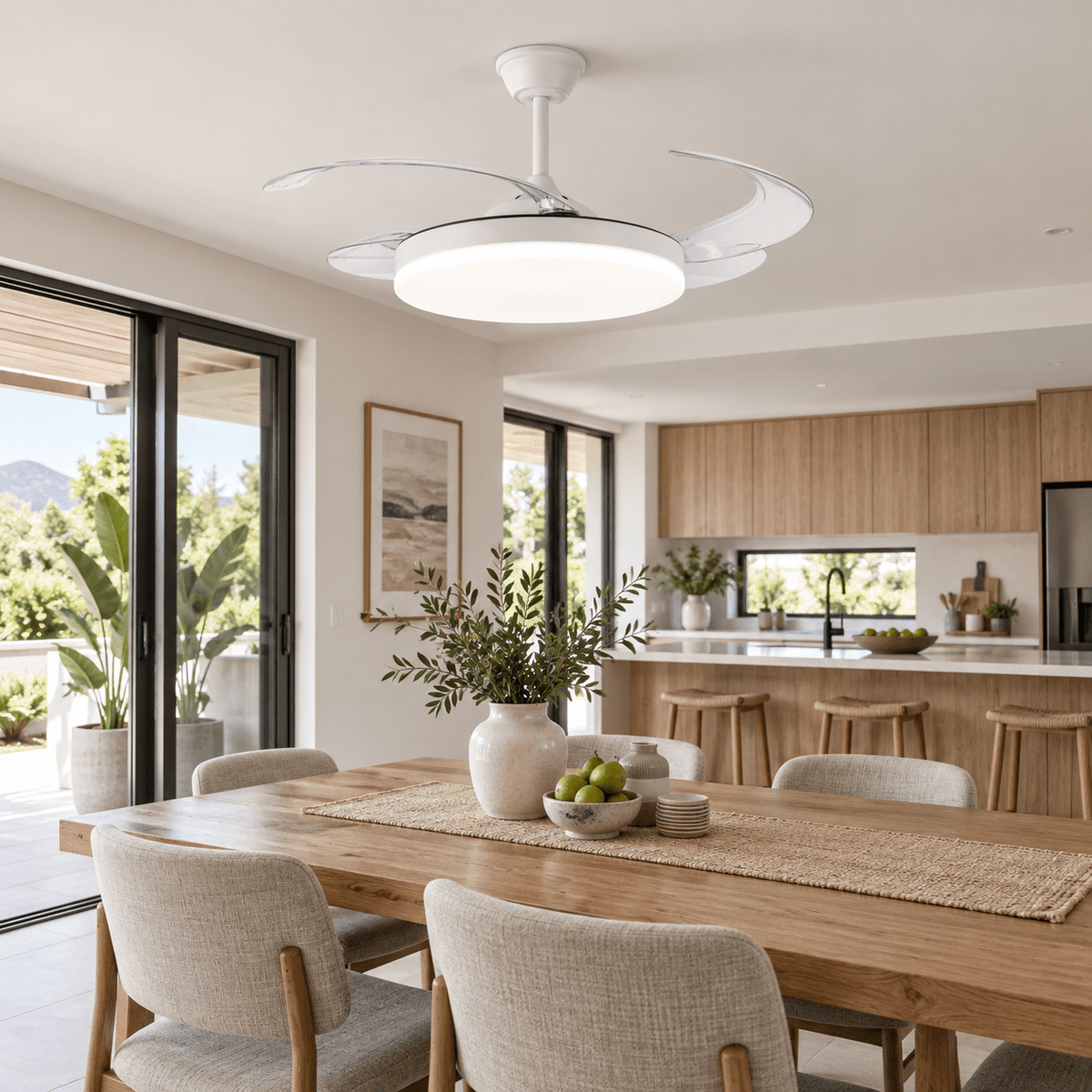 White retractable LED ceiling fan above a dining table
