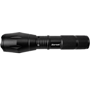 Black Zartek LED tactical flashlight with textured grip against green background