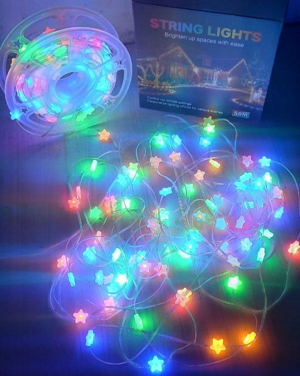 Multicolored string lights with star-shaped bulbs on a dark background